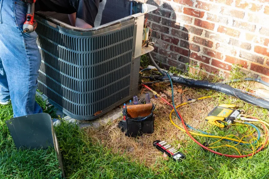A newly installed residential outdoor AC condenser unit